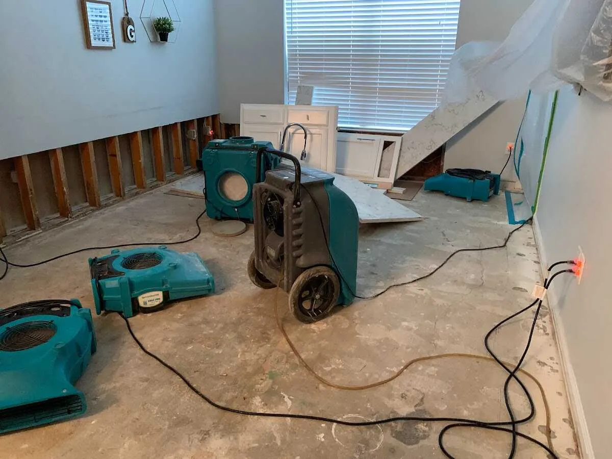 Dehumidifier in flood-cut room for Water Damage Restoration in Maple Shade